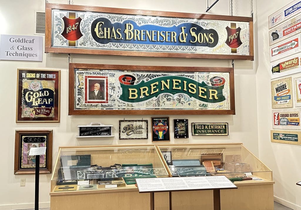 Gold leaf and glass signs displayed at American Sign Museum