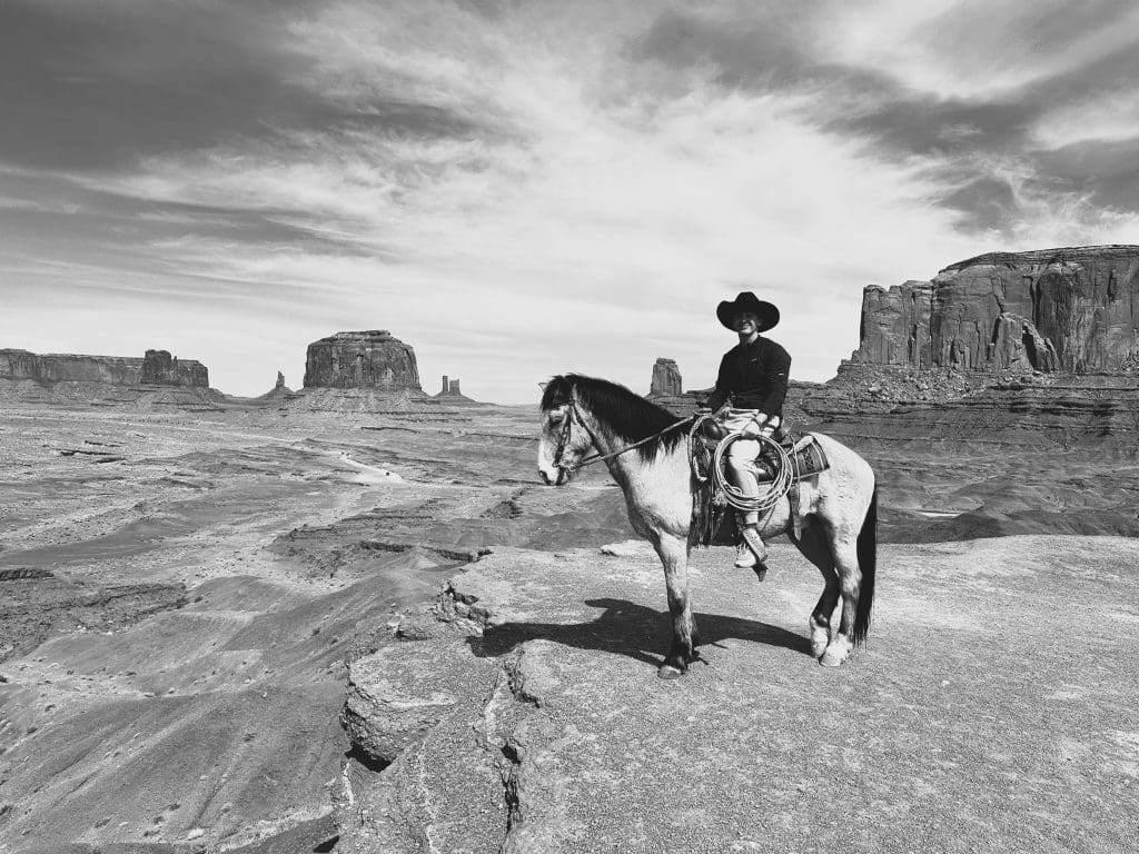 Boy on horse gets his picture taken at John Ford's Point in Monument Valley.