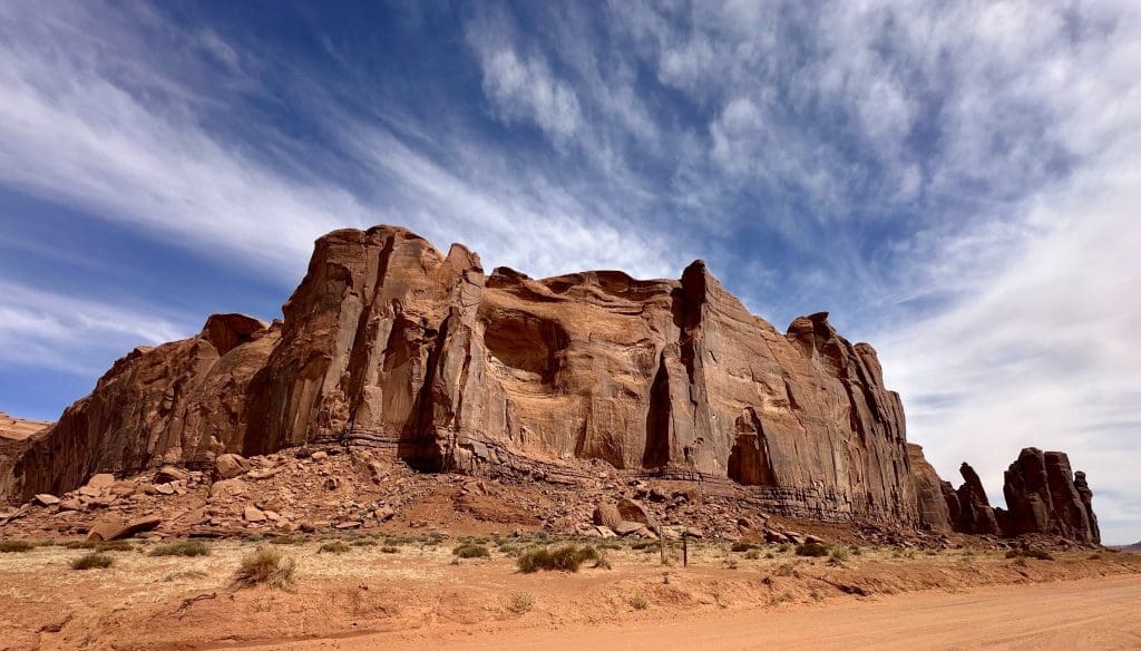 Rain God Mesa in Monument Valley. The rock's spiritual significance to the Navajo is that it brings life to the land.
