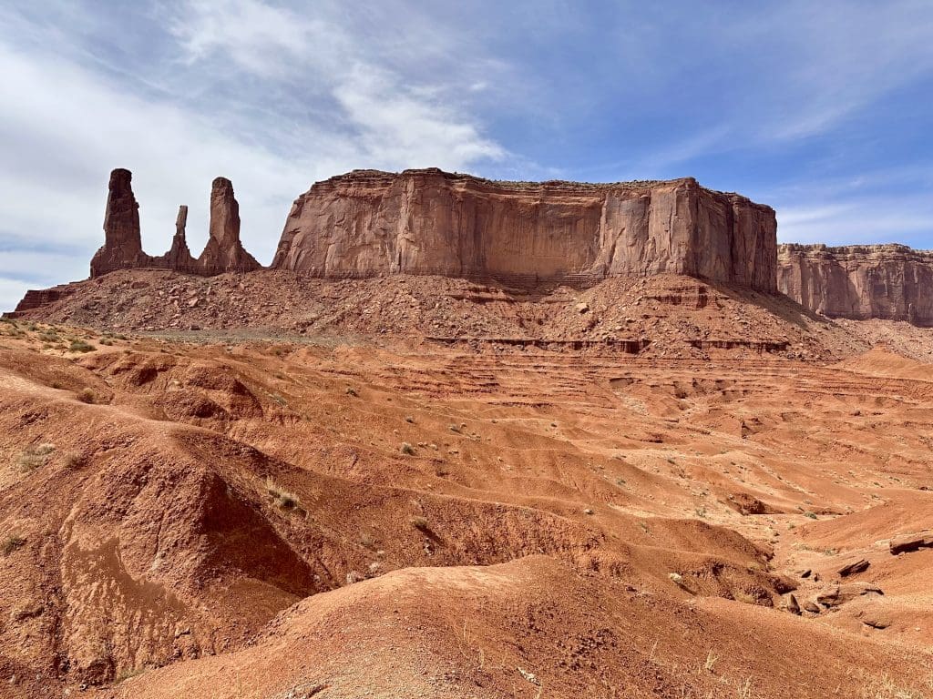 Three Sisters and Mitchell Mesa in Monument Valley.