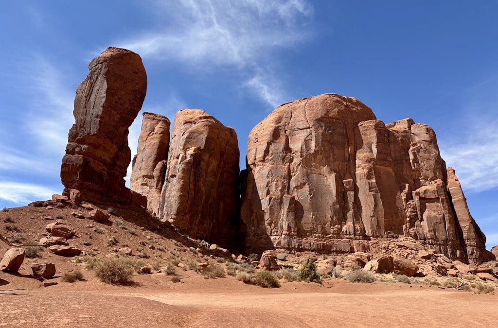 The Thump sticks out on the left of Camel Butte in Monument Valley
